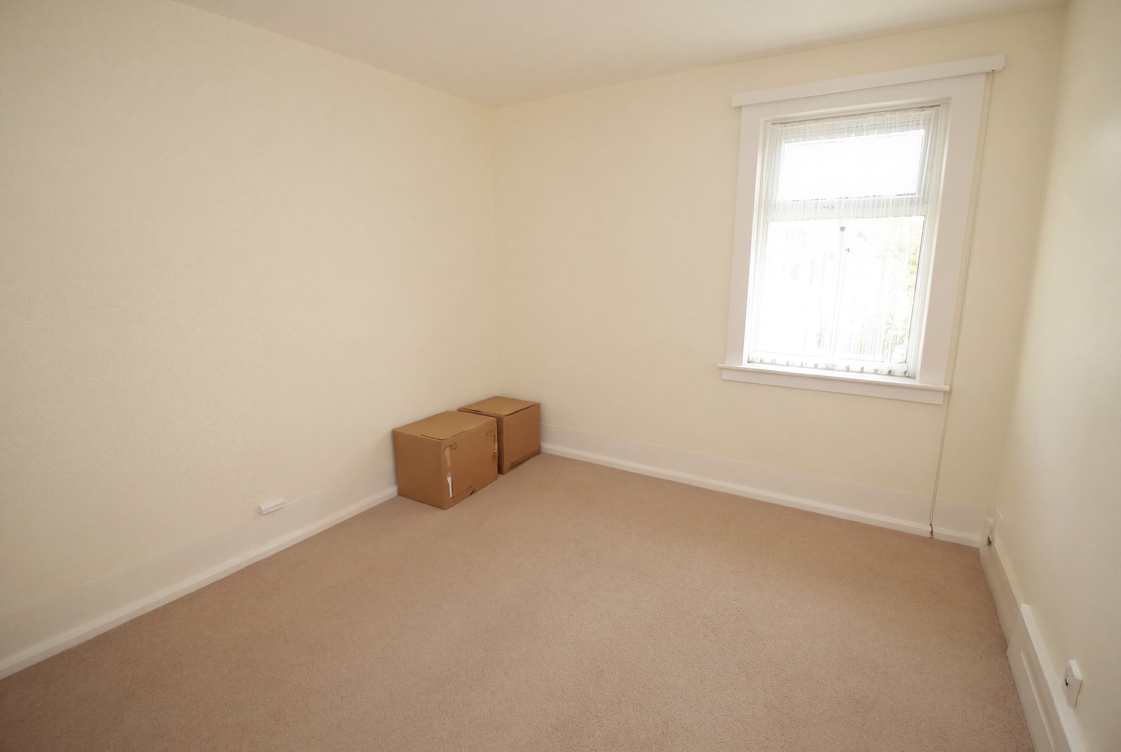 An empty spare room, as Modern Noir (before)